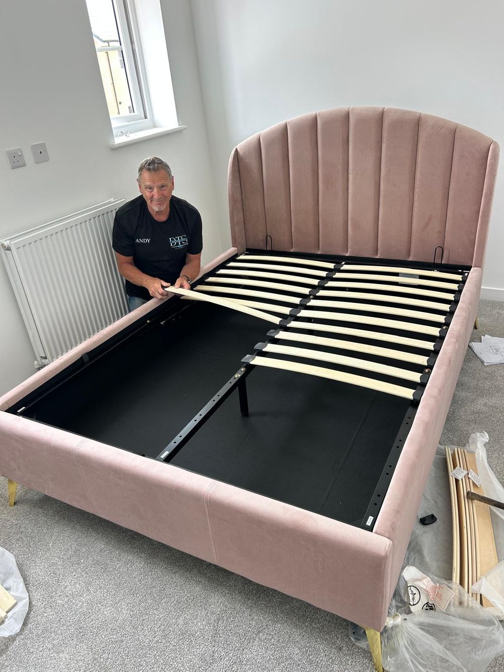 Davis Transport Services team member assembling a bed frame during a house move